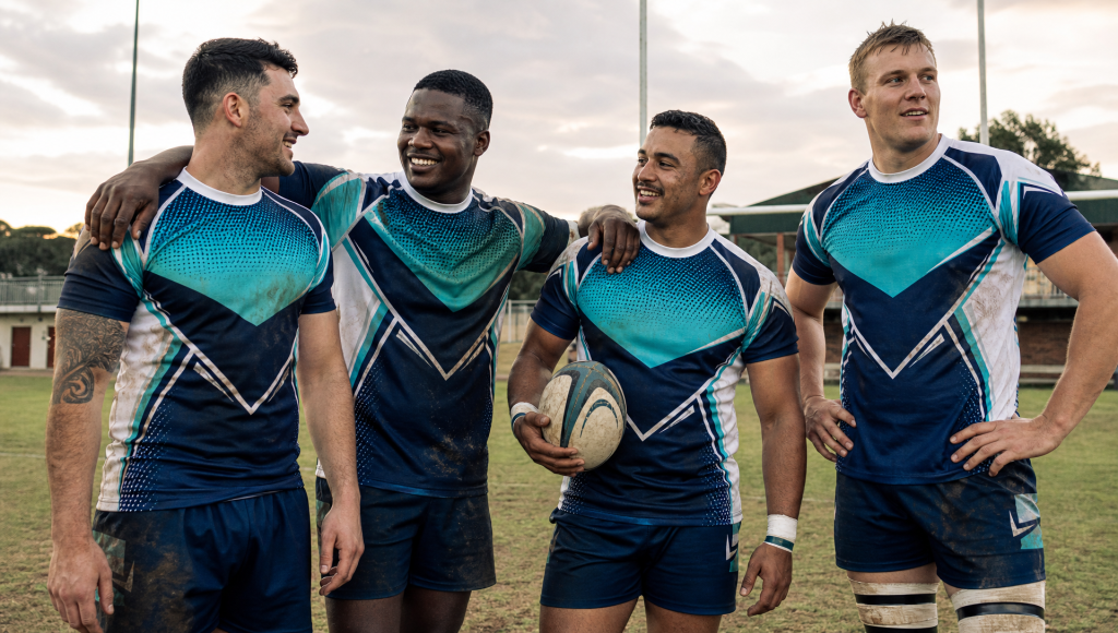 All-male South African rugby team wearing coordinated custom sportswear on a local training field.